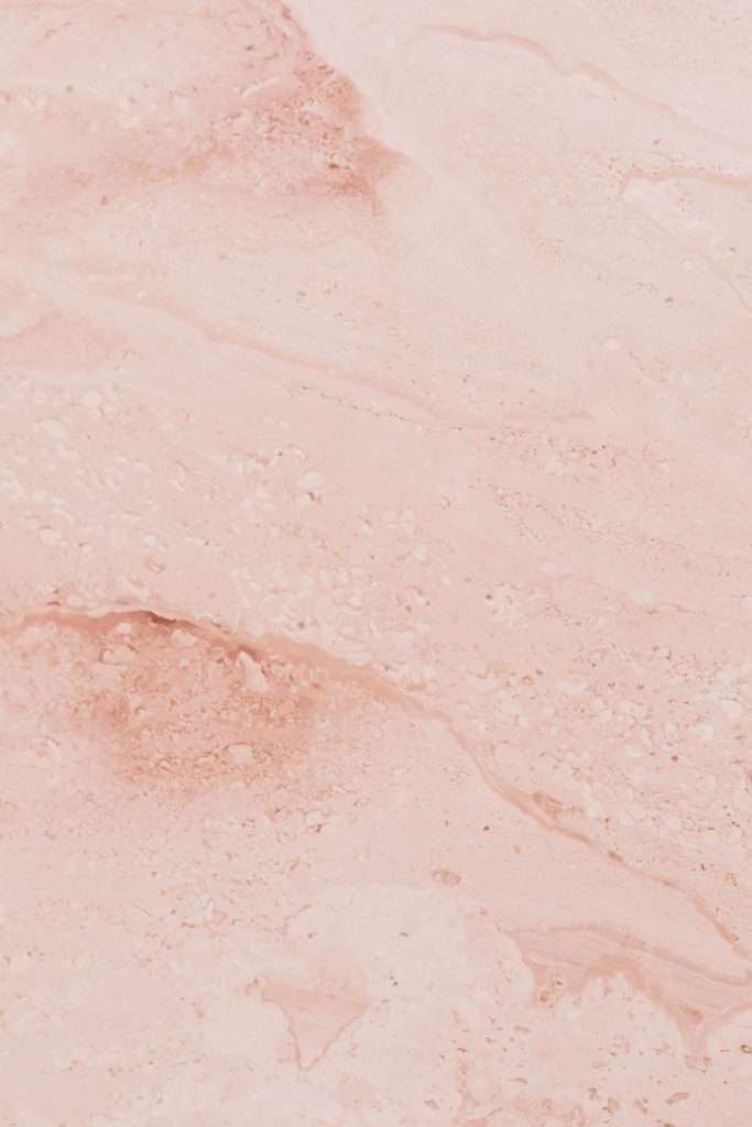 High-resolution pink marble texture ideal for design backgrounds and patterns.